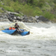 A rafter takes on a wave on the Hells Canyon stretch of the Snake River.