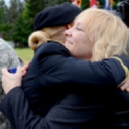 A mom hugs her daughter, a newly graduated officer in the US Army.